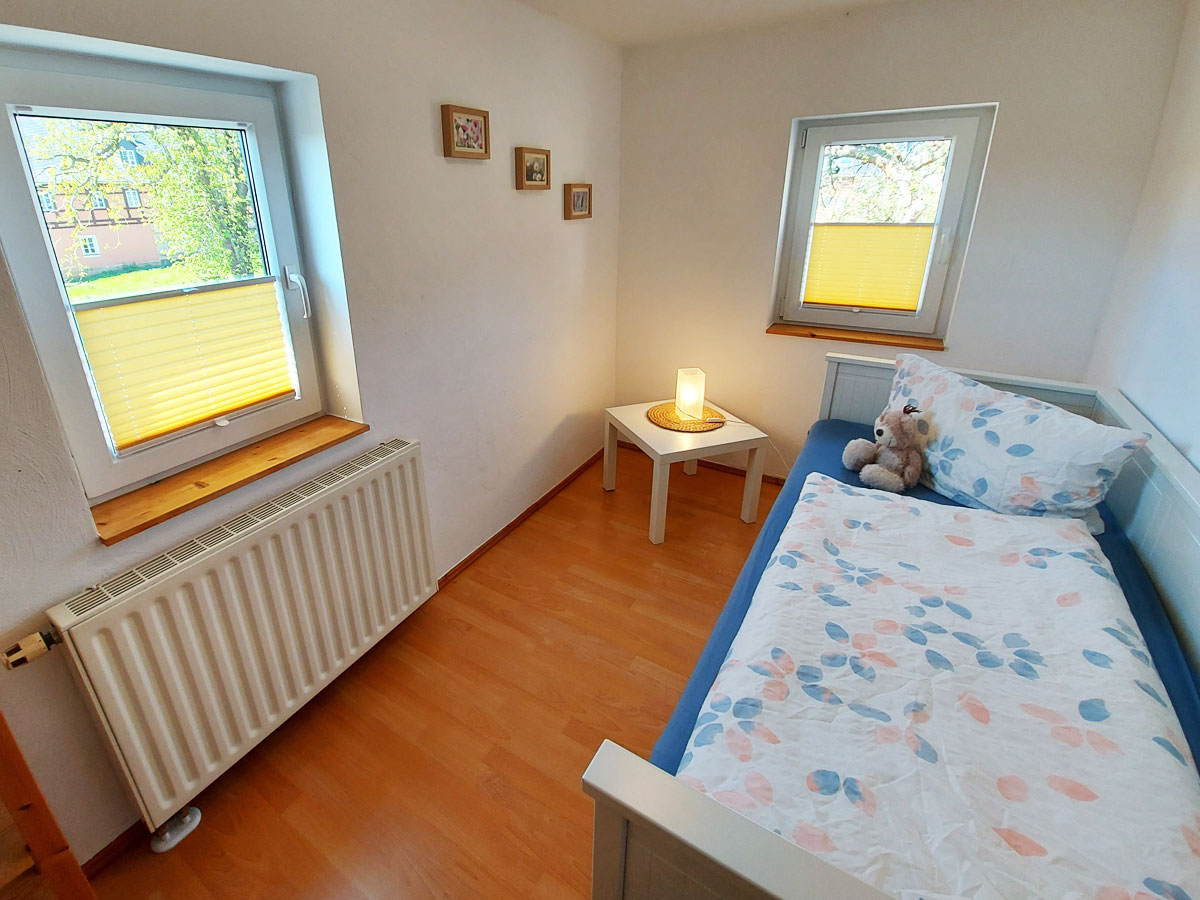 Ferienhaus Schrammsteinblick - Ferienwohnung2 - Schlafzimmer2 mit Bett